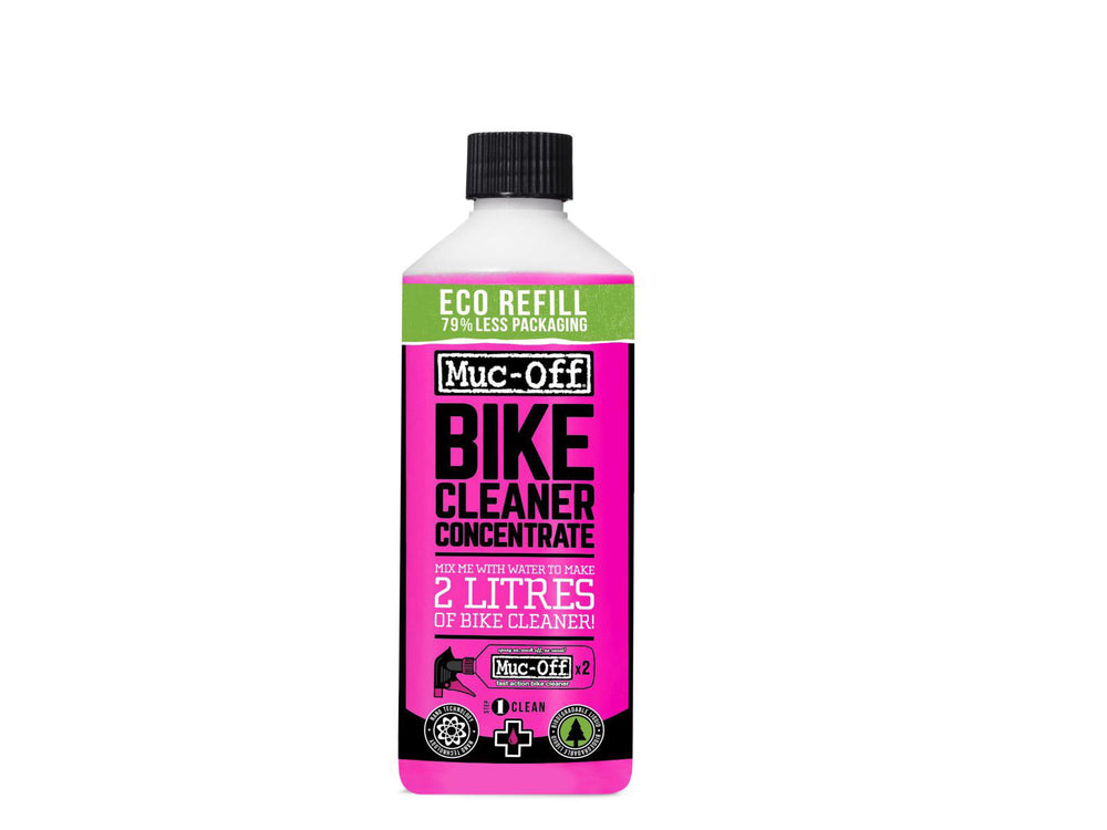 Mucoff Bike Cleaner Concentrate i en klar flaske med grøn etikette, står på en grå overflade. Produktet er designet til effektiv rengøring af cykler.